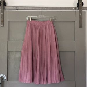 Pleated below the knee skirt